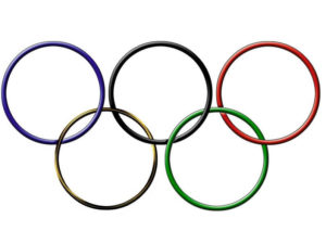 Five interlocking rings in blue, yellow, black, green, and red, symbolizing the Olympic Games.