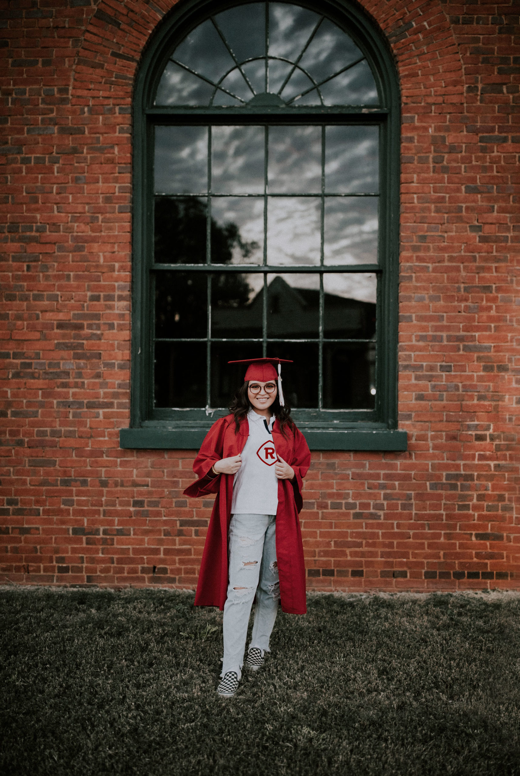 student in cap and gown at graduation