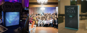 A collage of three images from gala events. The left shows auction paddles and a "Spotlight Gala" sign on a table, the middle shows a large group posing under chandeliers, and the right shows a program for "Hope Rocks" benefiting Faith's Lodge.