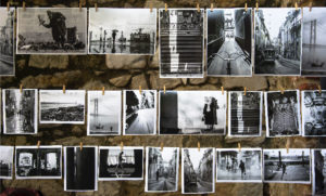 black and white photos hanging against wall