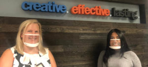Chelsea and Rosa in front of CEL word wall