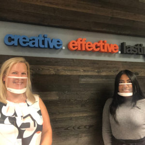 Chelsea and Rosa in front of CEL word wall