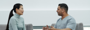 patient and nurse sitting in chairs talking