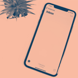 Smartphone with an email inbox open on the screen