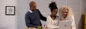 A family looking at a computer
