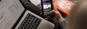 hand scrolling through social media on a smartphone