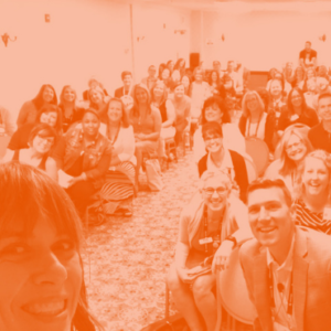 A group of school communications professionals smiling for a picture