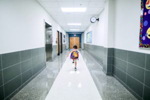 student running down a School Hallway