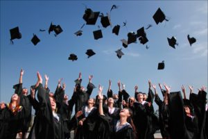 Graduation hats thrown into the air