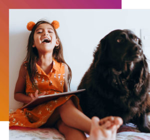 girl with dog schooling at home