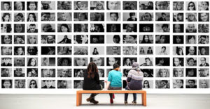 People on bench in gallery