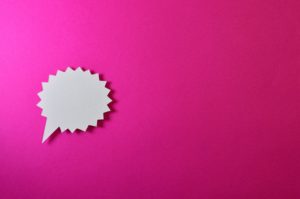 Pink background with white speech bubble
