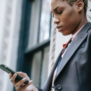 Woman looking down at her cell phone