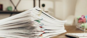 a stack of paperclipped documents