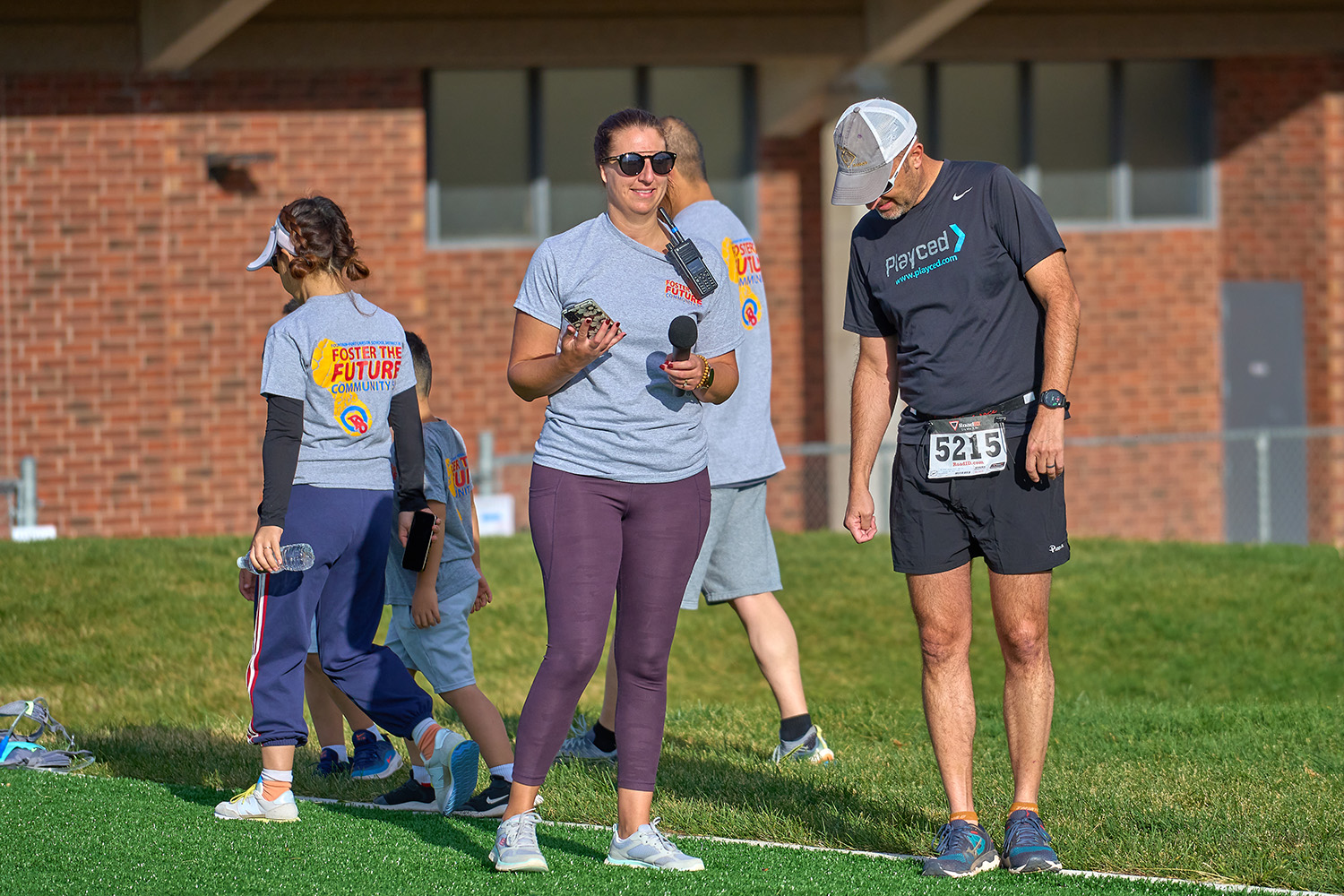 volunteers wearing community 5k foster the future tshirts