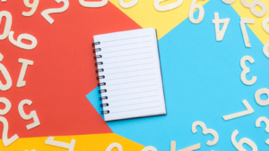 empty notebook surrounded by numbers