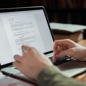 a person typing on a computer