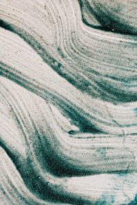 Decorative green and white swirls