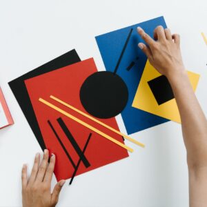 Person Holding Blue Red and White Book