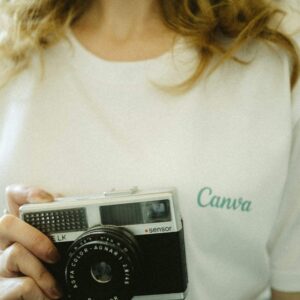 Midsection view of Woman Holding Camera