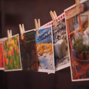 Photographs clothespinned to a rope