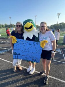 two women with an eagle mascot