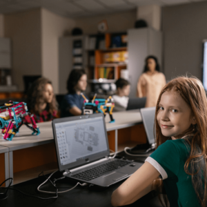 Classroom of students and teacher who are learning robotics