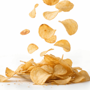Potato chips falling into a bowl