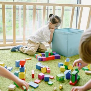 Kindergarten child playing with blocks