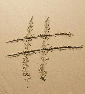 Hashtag sign in the sand