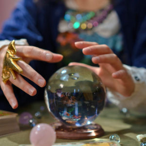 A fortune teller using a crystal to decipher what kind of School Communicator you are